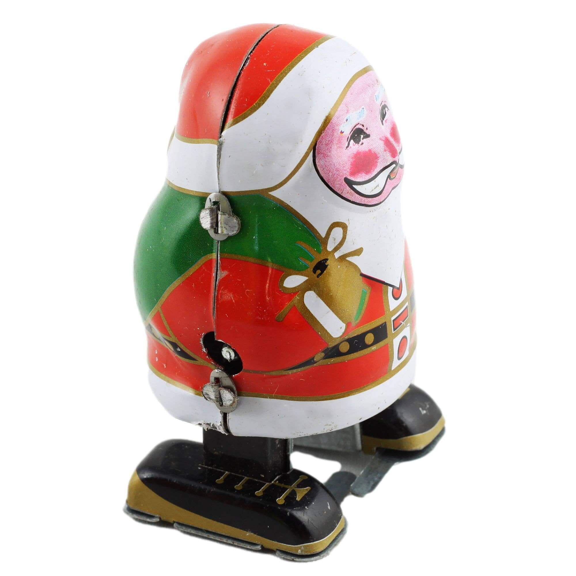 Aufziehbarer Zinn-Weihnachtsmann, handbemalte Retro-Figur mit Schlüssel, 8 cm auf einem weißen Hintergrund.