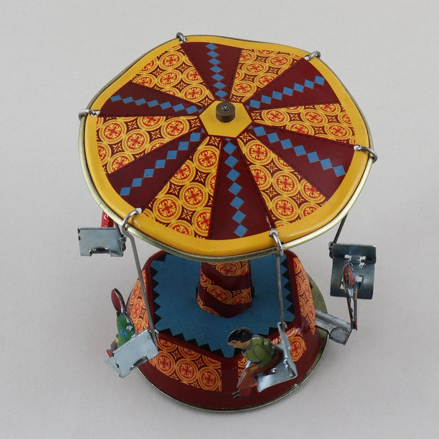 Blechspielzeug Karussell Schaukel Jahrmarkt Retro Tin-Spielzeug 01 Miniatur, handgemachtes, drehendes Blechkarussell im Retro-Design.