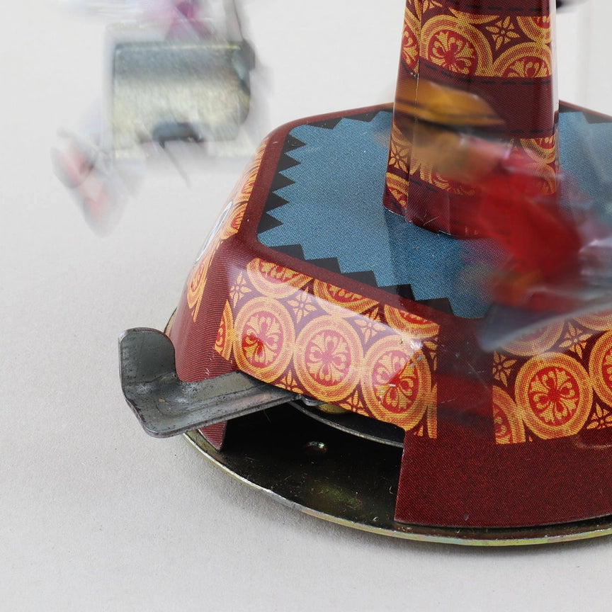 Blechspielzeug Karussell Schaukel Jahrmarkt Retro Tin-Spielzeug 01 Miniatur mit farbigen Details und drehender Plattform.