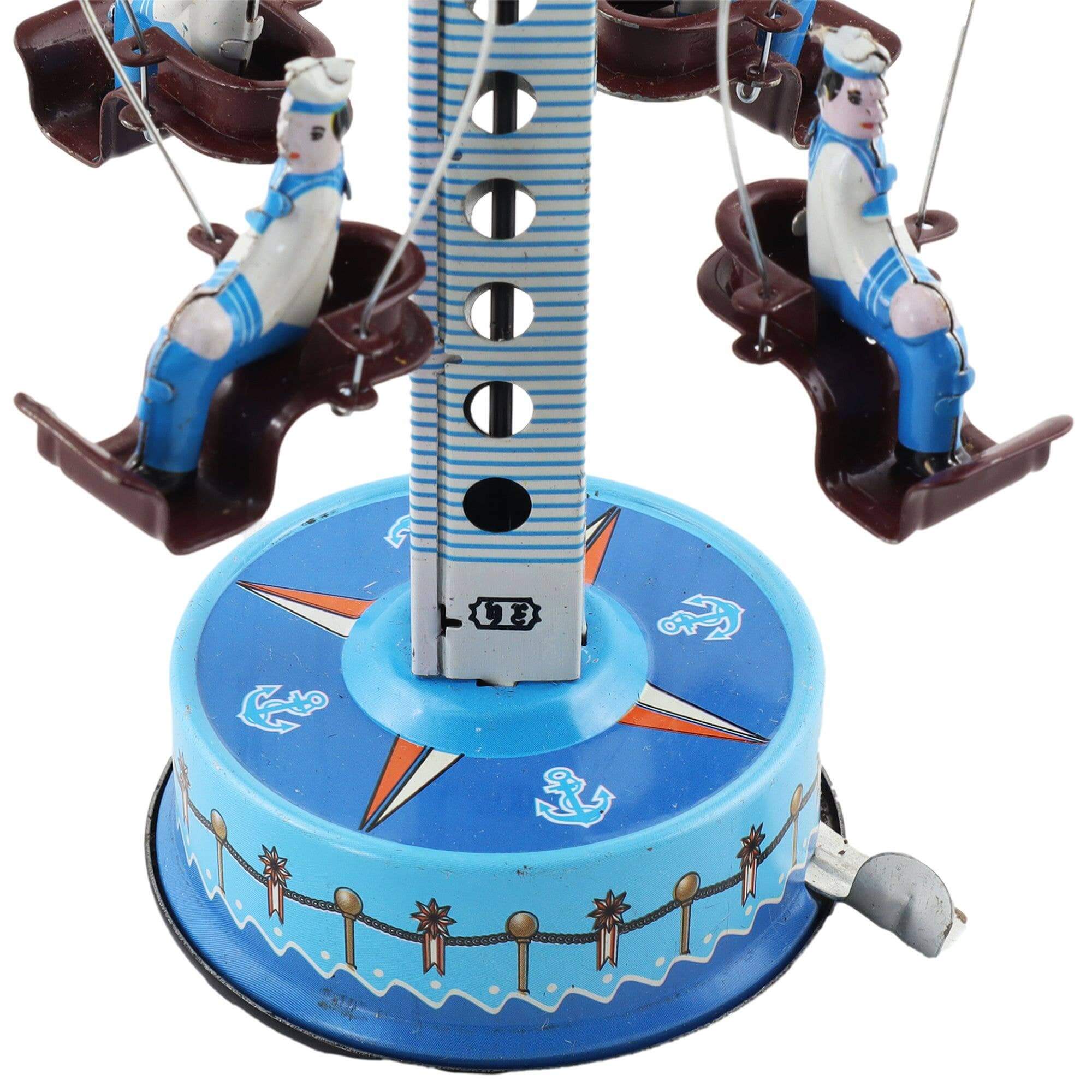 Handaufgezogenes Blechkarussell Matrosen – Nostalgisches Vintage Spielzeug mit maritimen Motiven.